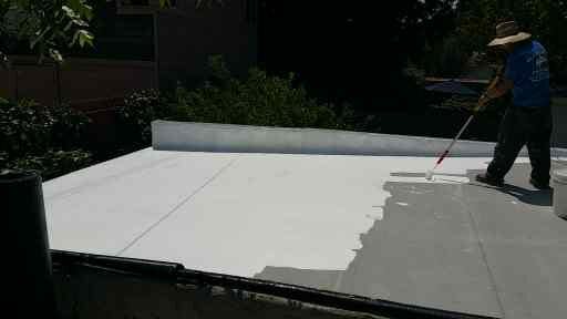 Roof coating in progress